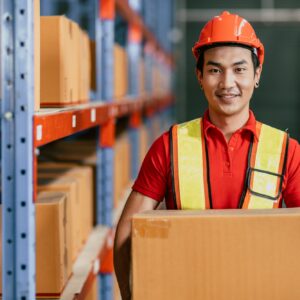 Warehouse staff worker at cargo inventory handle goods products box portrait happy smiling